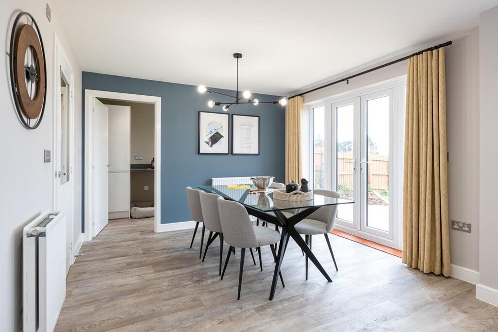 Garden access through the French doors, brightening up the room with natural light