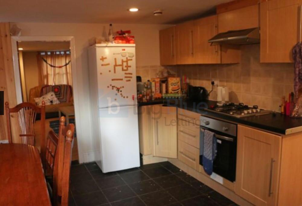 A warm and functional kitchen featuring wooden ...