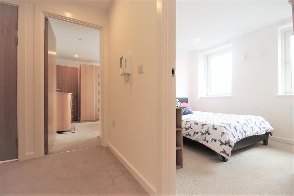 A bright and cozy double bedroom featuring a co...