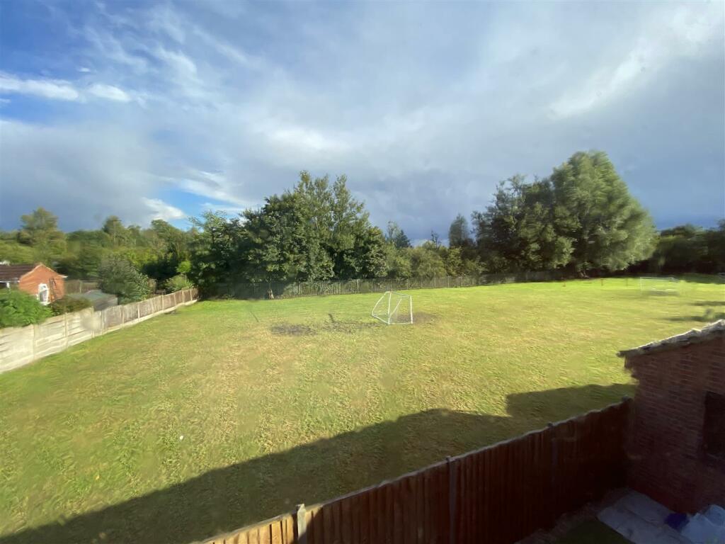 To the rear of the property is the school playing 