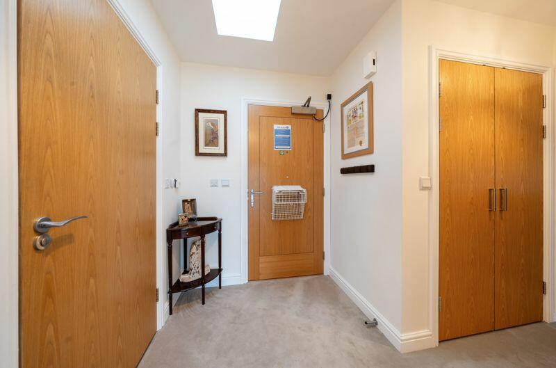 Entrance hall with storage cupboard
