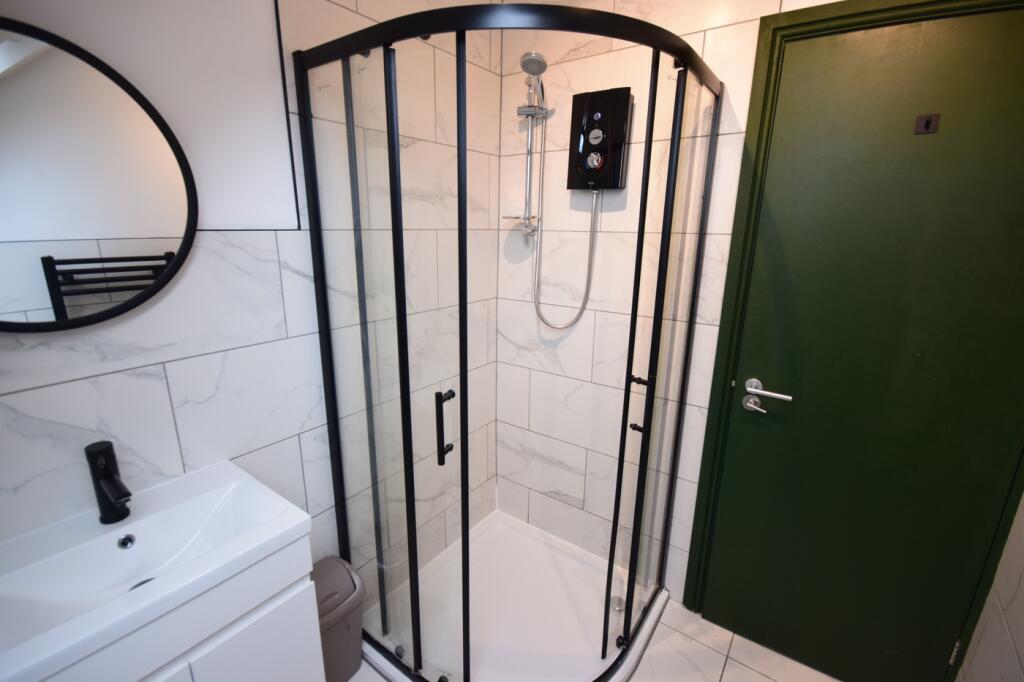 A bright and modern bathroom featuring a stylis...