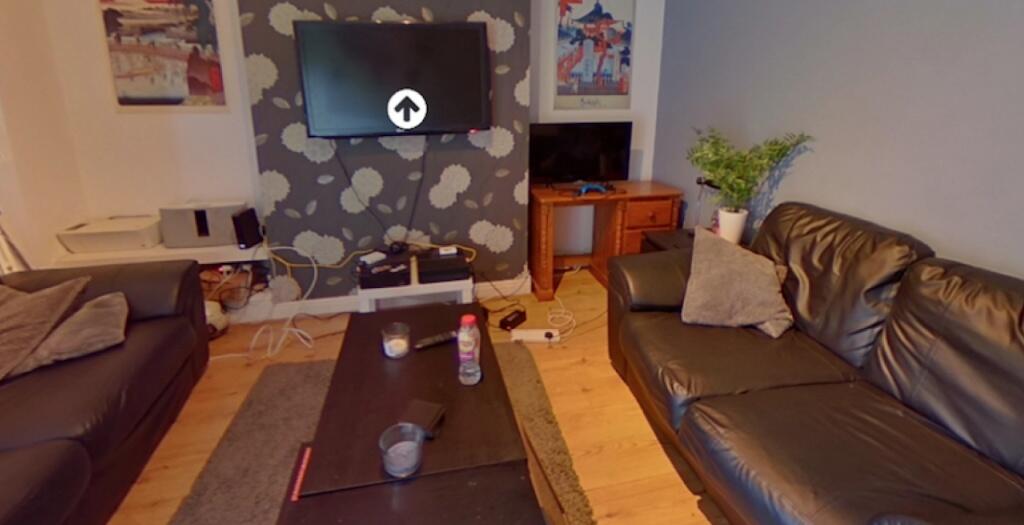 A cozy living room featuring two comfortable le...