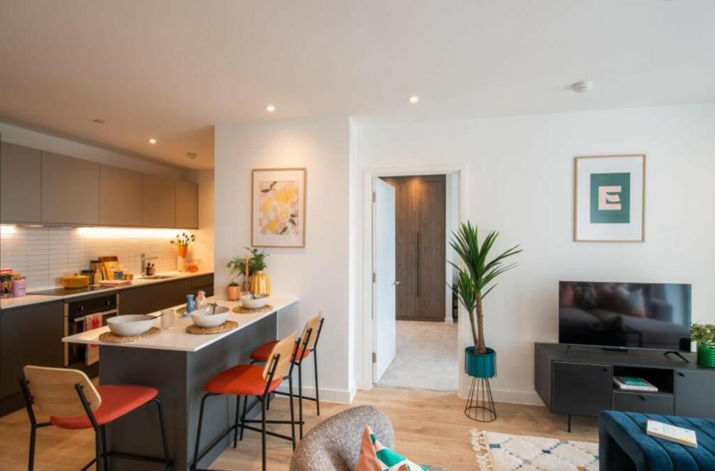 A spacious and modern living room with a well-m...