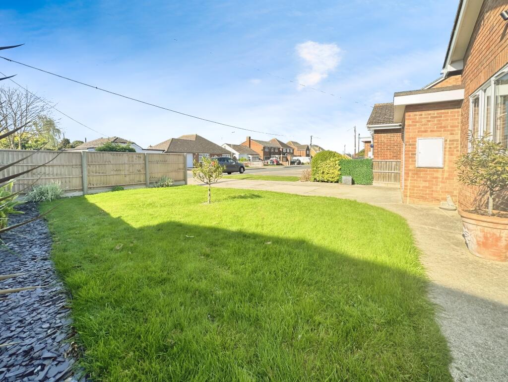 Front Driveway View With Garden