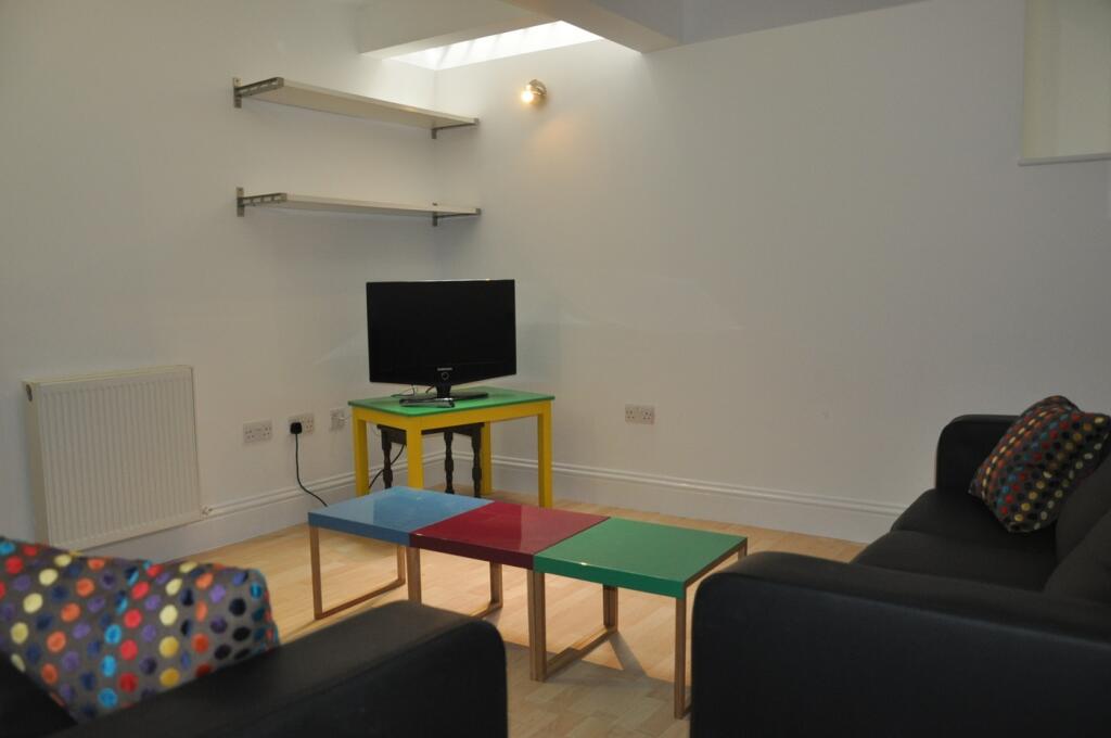 A bright and inviting living room with a modern...