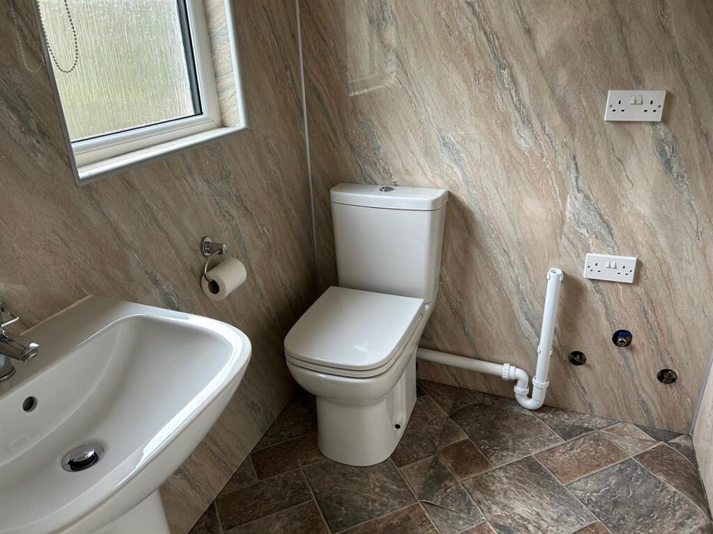 CLOAKROOM/UTILITY ROOM