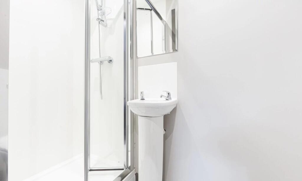 A bright and modern bathroom featuring a clean ...