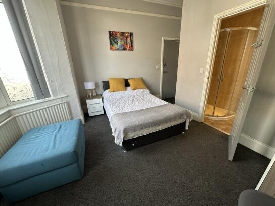 Bright and inviting master bedroom featuring a ...