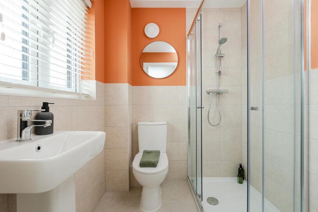 Bedroom 1 also hosts a private en suite shower room