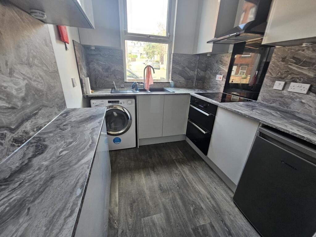 Modern and well-maintained kitchen with sleek c...