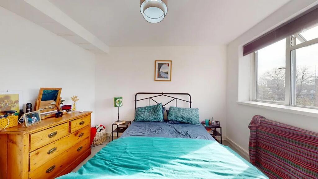 Bright and inviting double bedroom featuring a ...