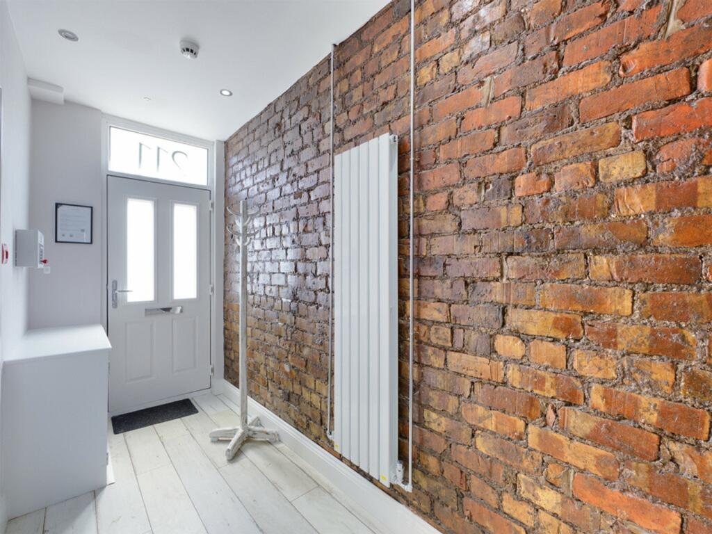 A stylish and well-maintained hallway featuring...