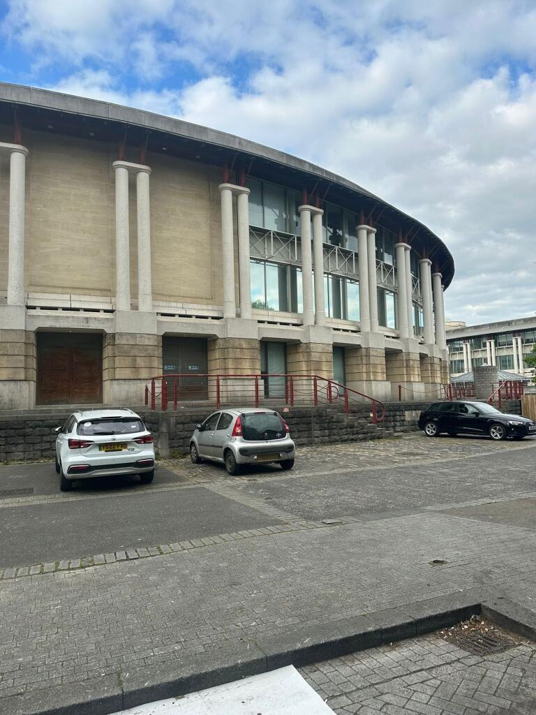 View of an impressive building facade with tall...