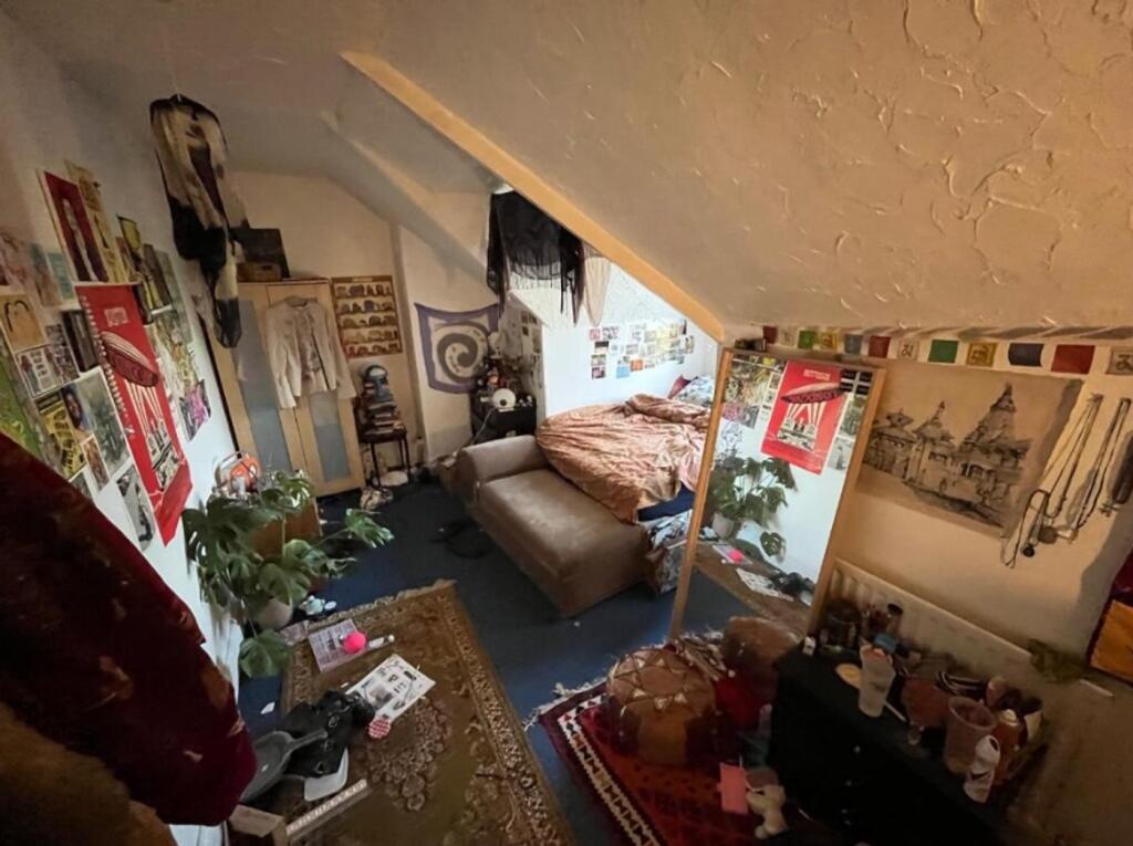 A cozy double bedroom filled with character, pe...