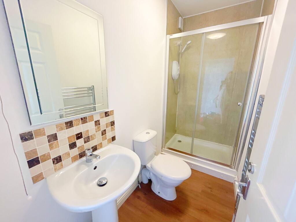 A clean and modern bathroom featuring a spaciou...