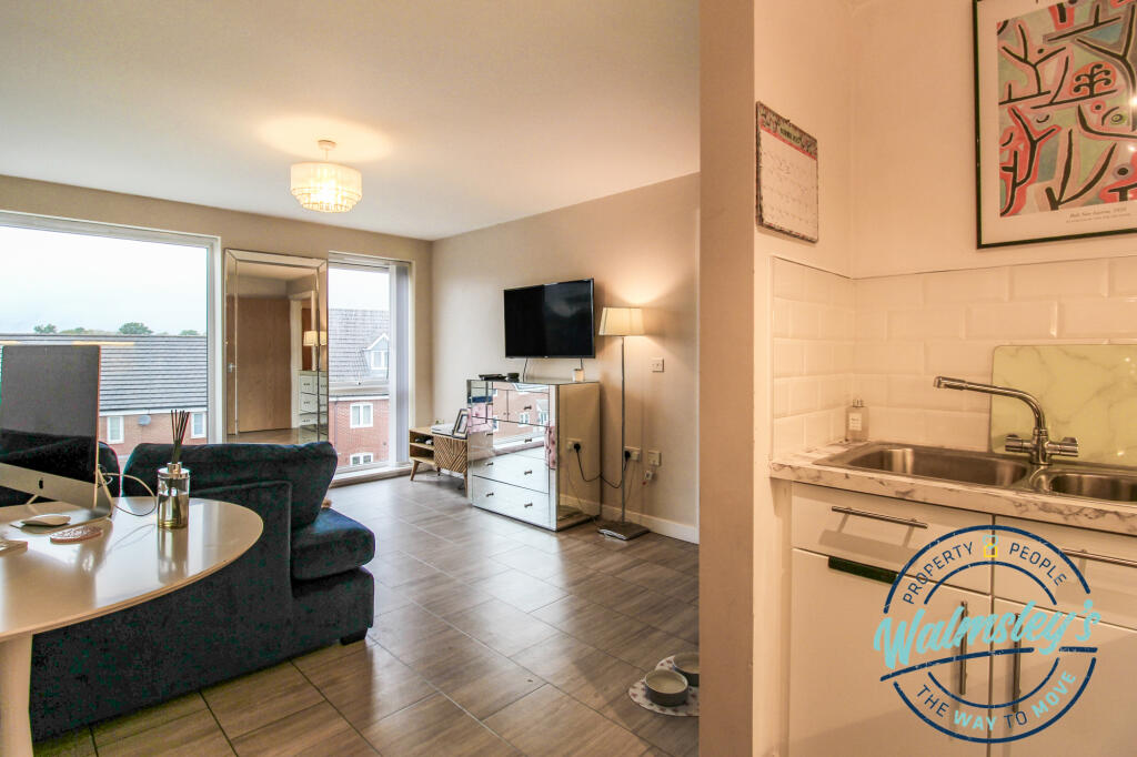 Kitchen through to sitting room