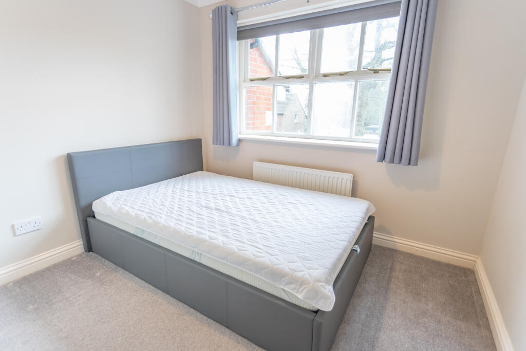 Bedroom 2 with wardrobes