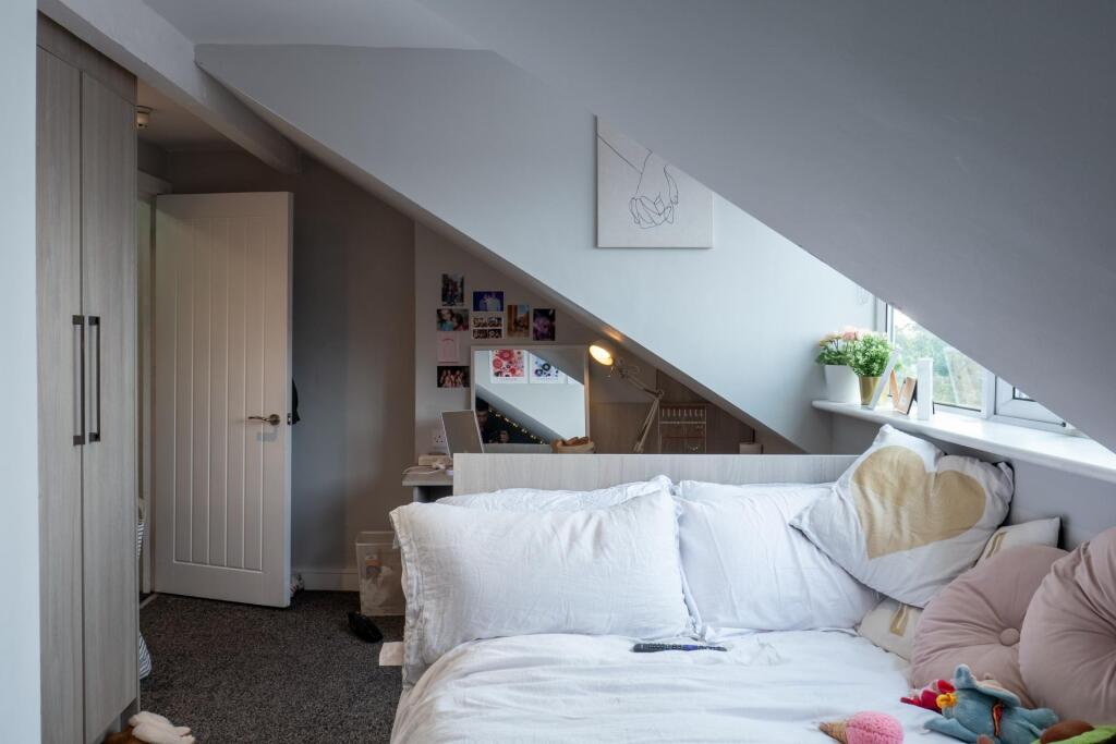 A bright and welcoming living room with a comfo...