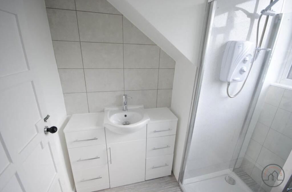 A clean and bright bathroom featuring a washing...