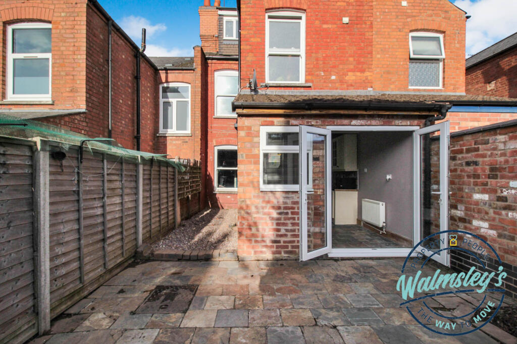 Rear patio with French doors to garden