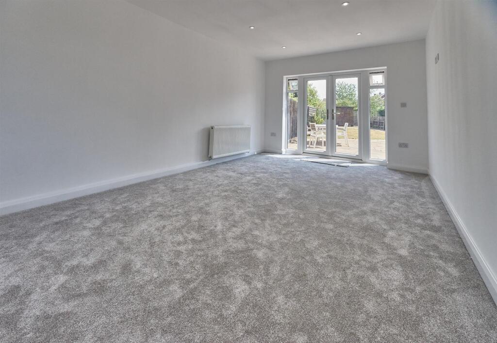 THROUGH LOUNGE/DINING ROOM
