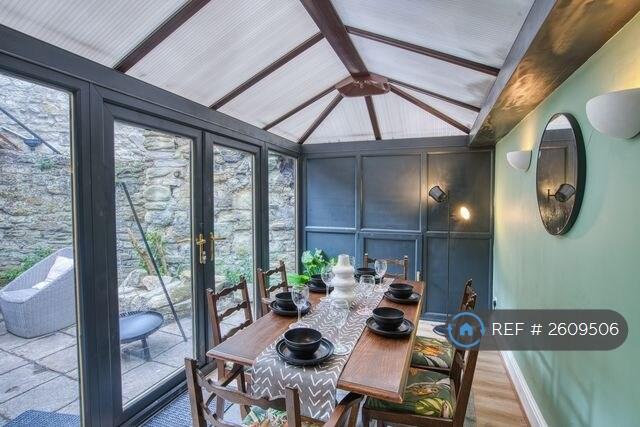 Dining Room And Doors Opening Into Private Yard