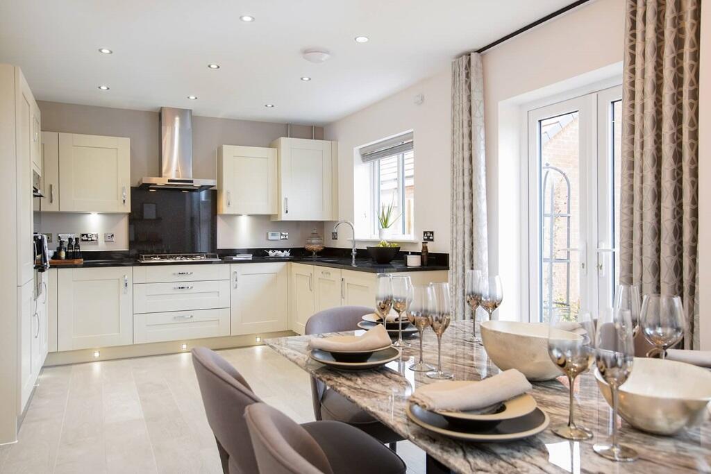 The kitchen/dining/family room boasts doors to the garden