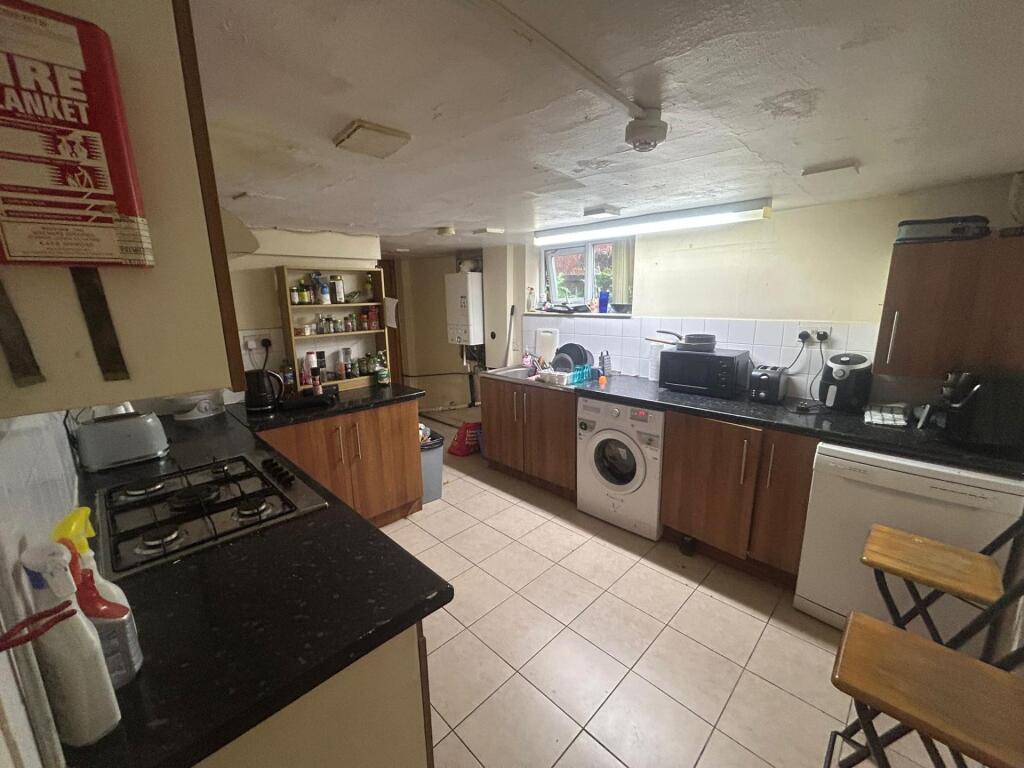 A well-lit, modern kitchen with ample workspace...