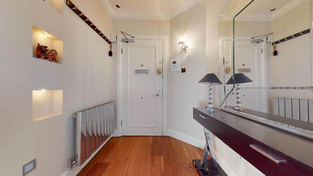 A clean and well-maintained hallway featuring s...