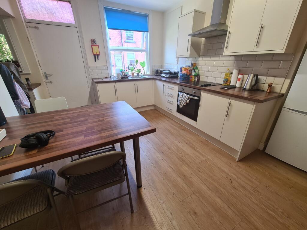 Bright and modern kitchen featuring ample count...