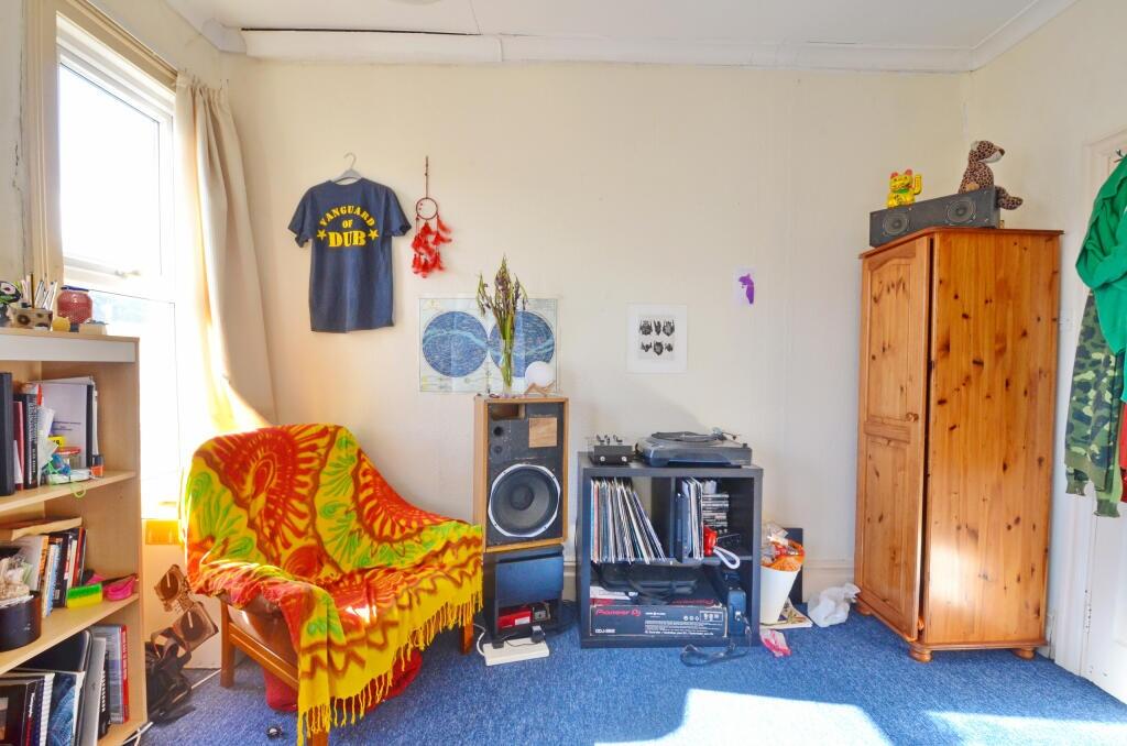 A bright and inviting living room featuring a c...
