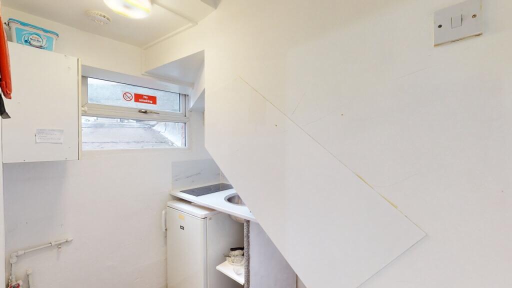 A compact and functional storage area with whit...