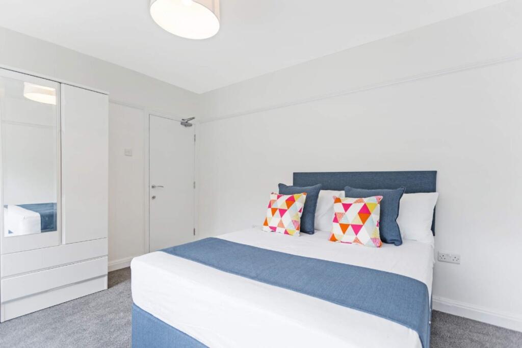 A bright and inviting double bedroom featuring ...