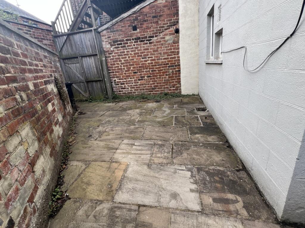 Far Rear paved area