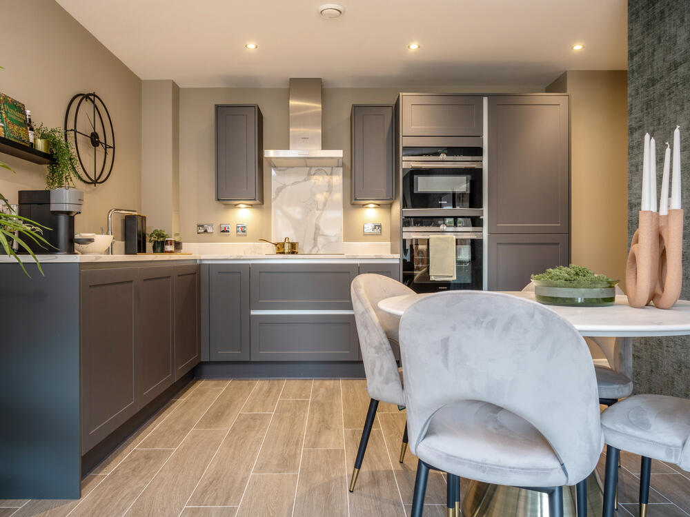 Image showcasing the stylish midnight blue kitchen with dining table and 4 chairs in the open-plan l