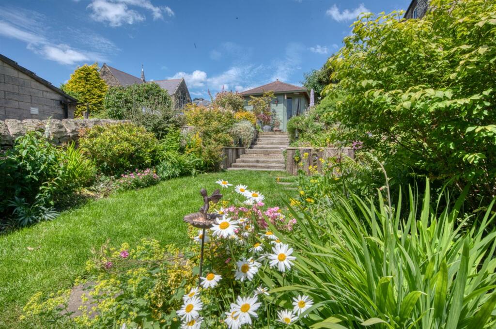 Rear Garden - lawn and steps to summer house.jpg