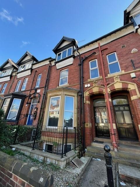 Attractive red-brick terraced property with bay...
