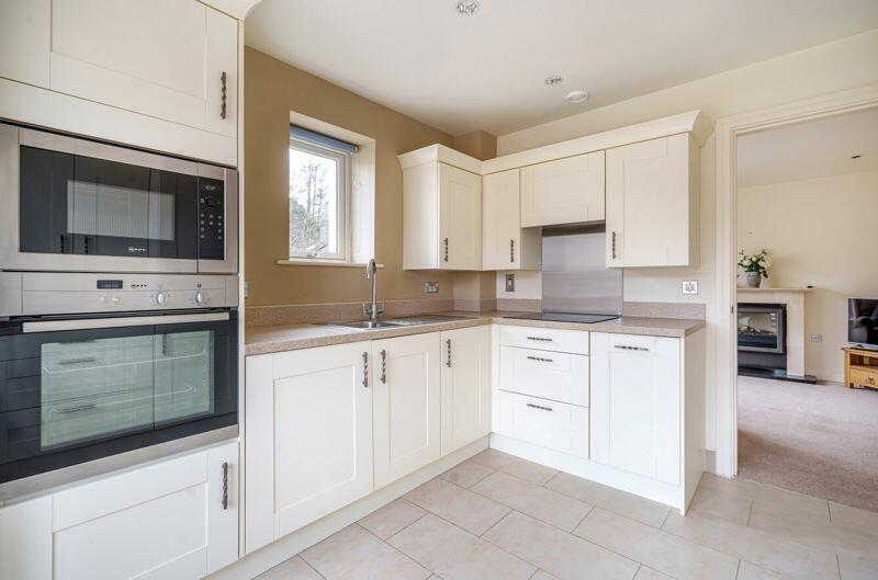 Large kitchen with integrated appliances