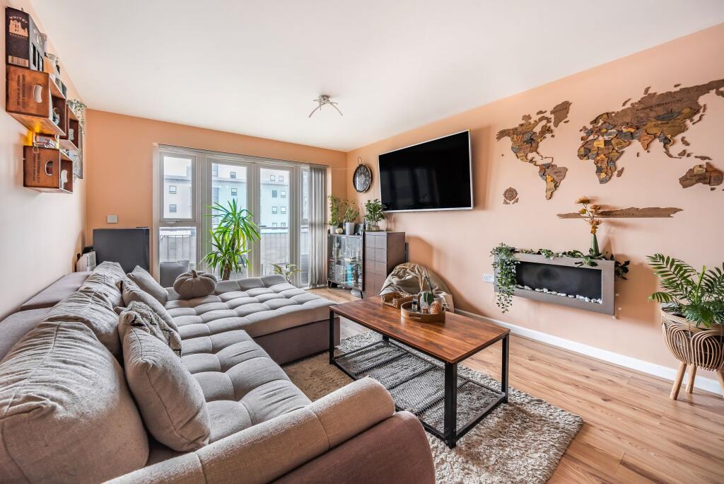 Open plan living space with balcony
