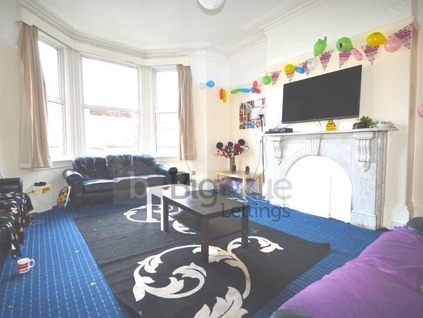 A bright and inviting living room featuring a l...