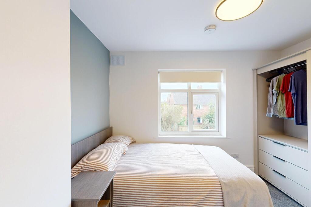 Bright and inviting double bedroom featuring a ...