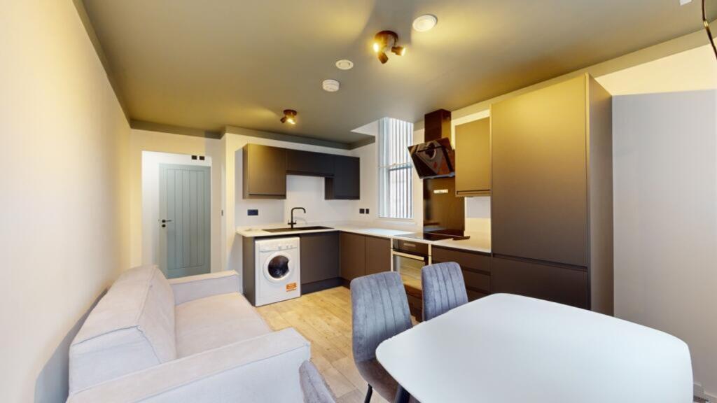 A modern and clean kitchenette featuring stylis...