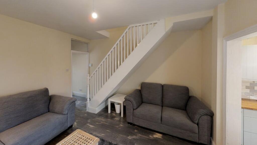 A cozy living room featuring comfortable seatin...