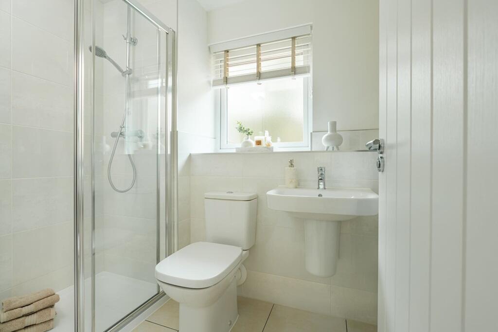 The main bedroom has its own en-suite shower room