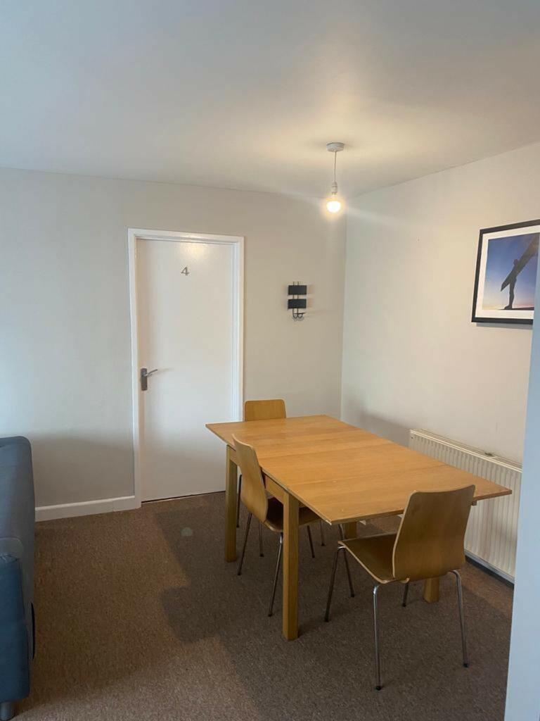 A cozy communal lounge featuring a stylish wood...