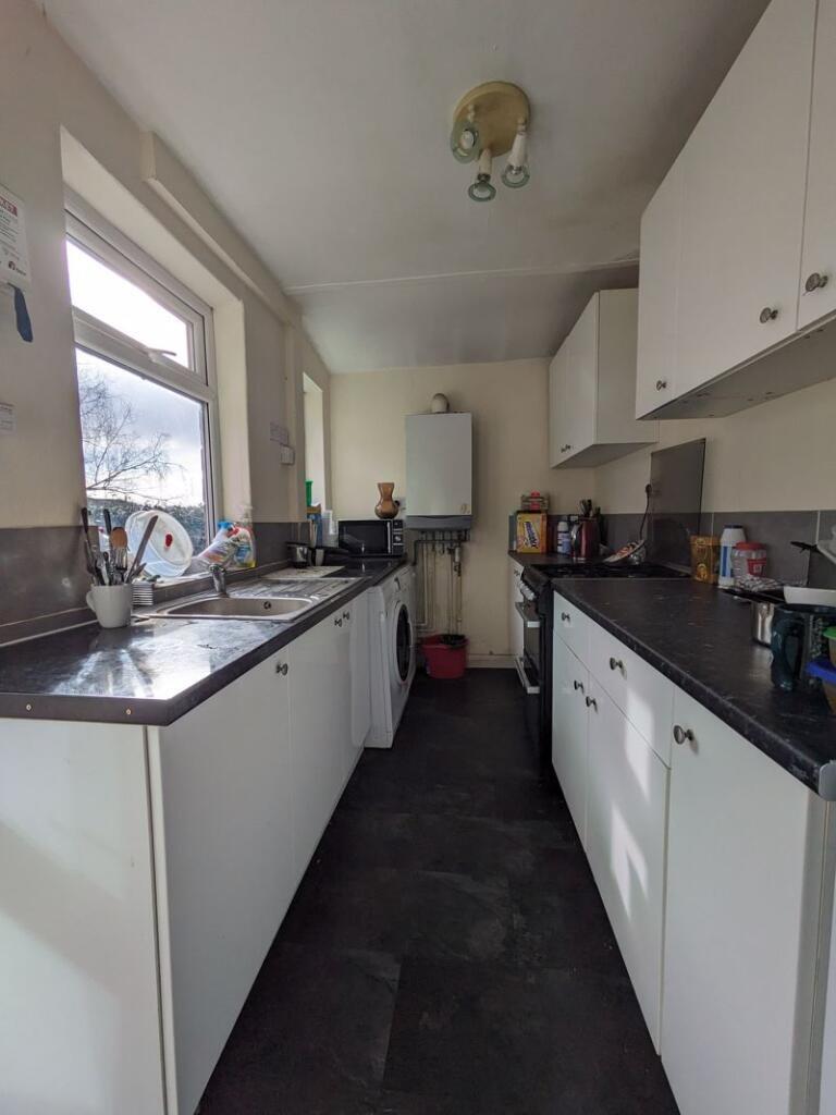 Bright kitchen featuring ample countertop space...