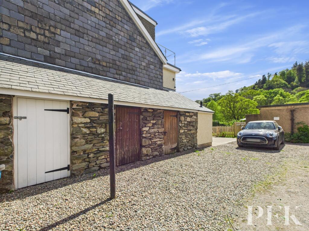 Side outhouse (white door) and Parking