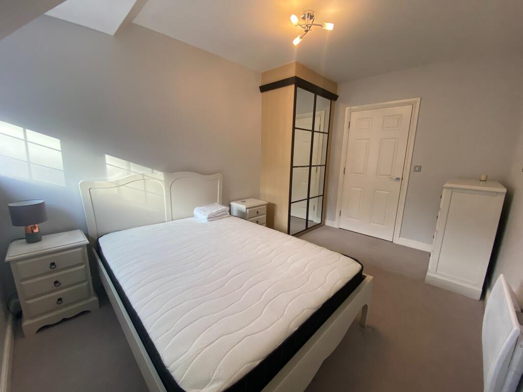 Bedroom 2 with wardrobes