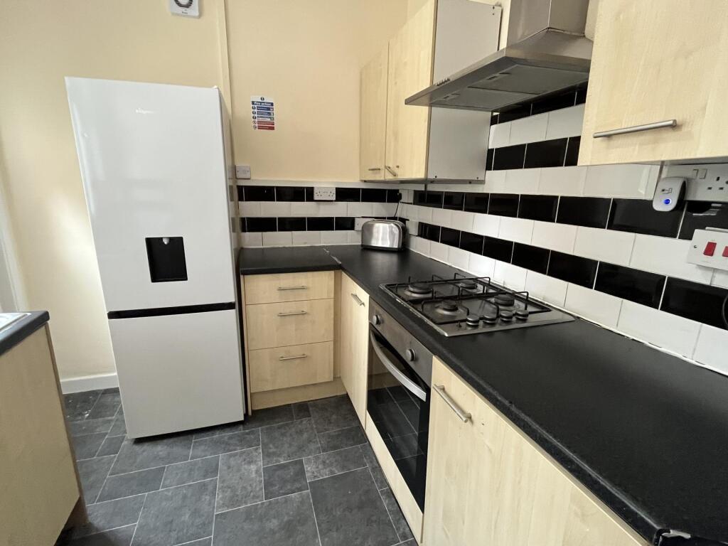 Modern kitchen featuring a gas hob, built-in ov...